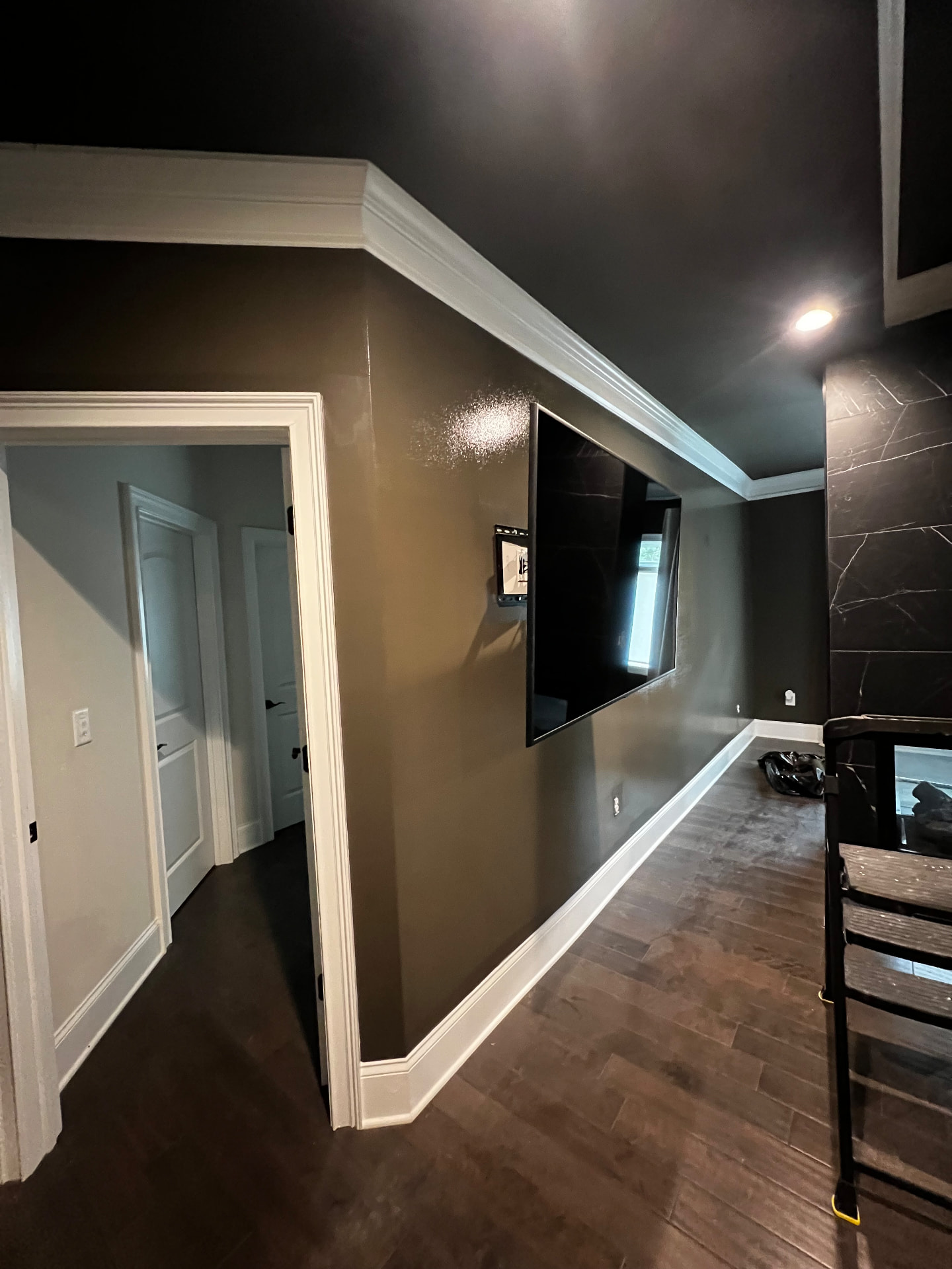 Freshly painted room with crisp white crown molding and trim